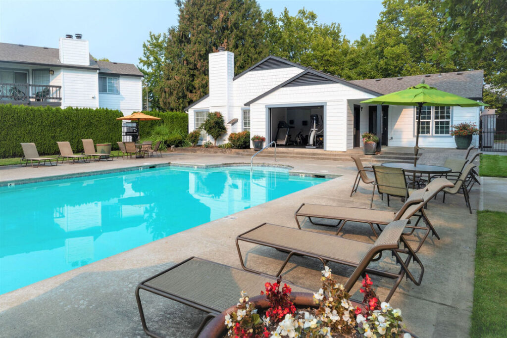 Relaxing pool with loungers at Sedona at Bridgecreek apartments in Vancouver, WA