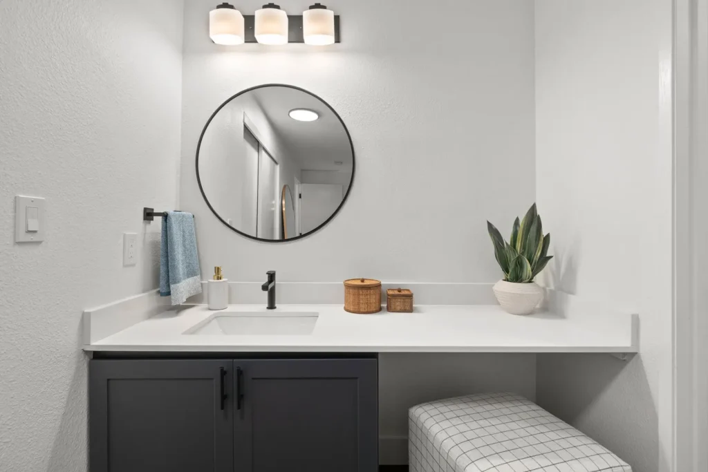bathroom vanity with sitting area